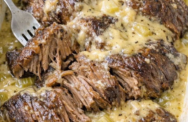 Tender oven-baked 3-ingredient celery soup pot roast with creamy gravy and shredded beef