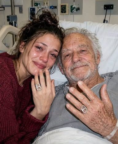 Young woman smiling with an eldery man
